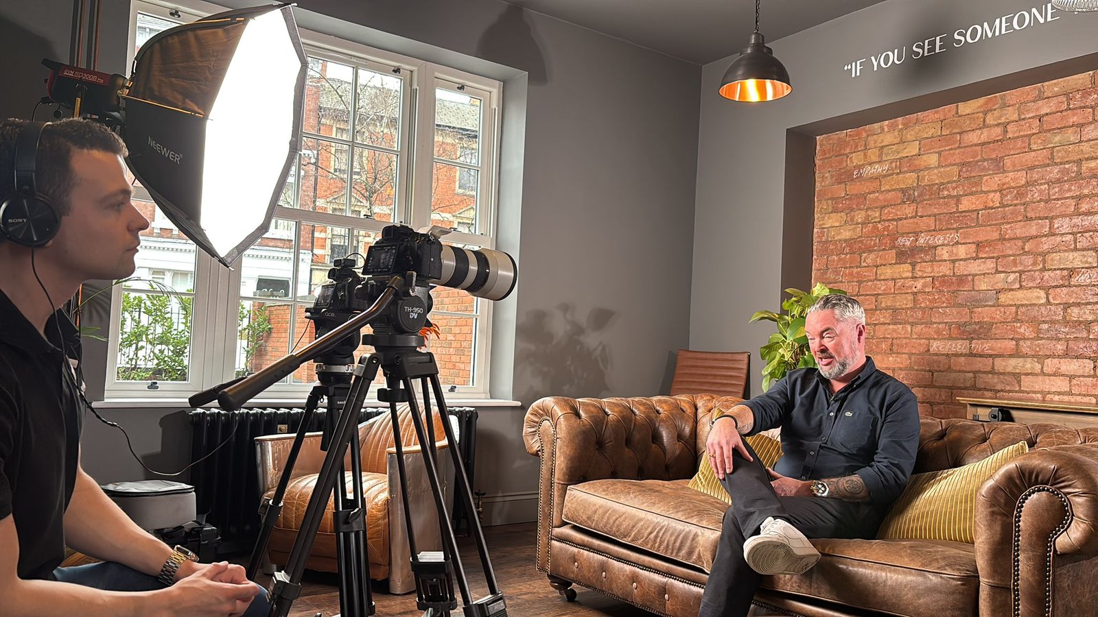 Tom on set with an interviewee